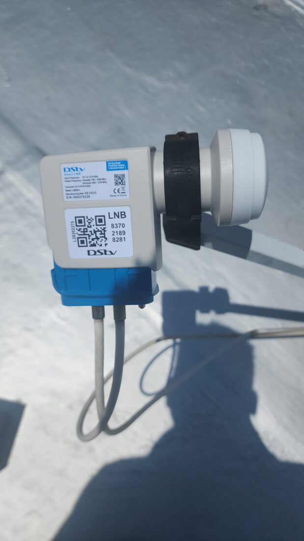 Close-up of a DStv Smart LNB installed on a satellite dish on a rooftop